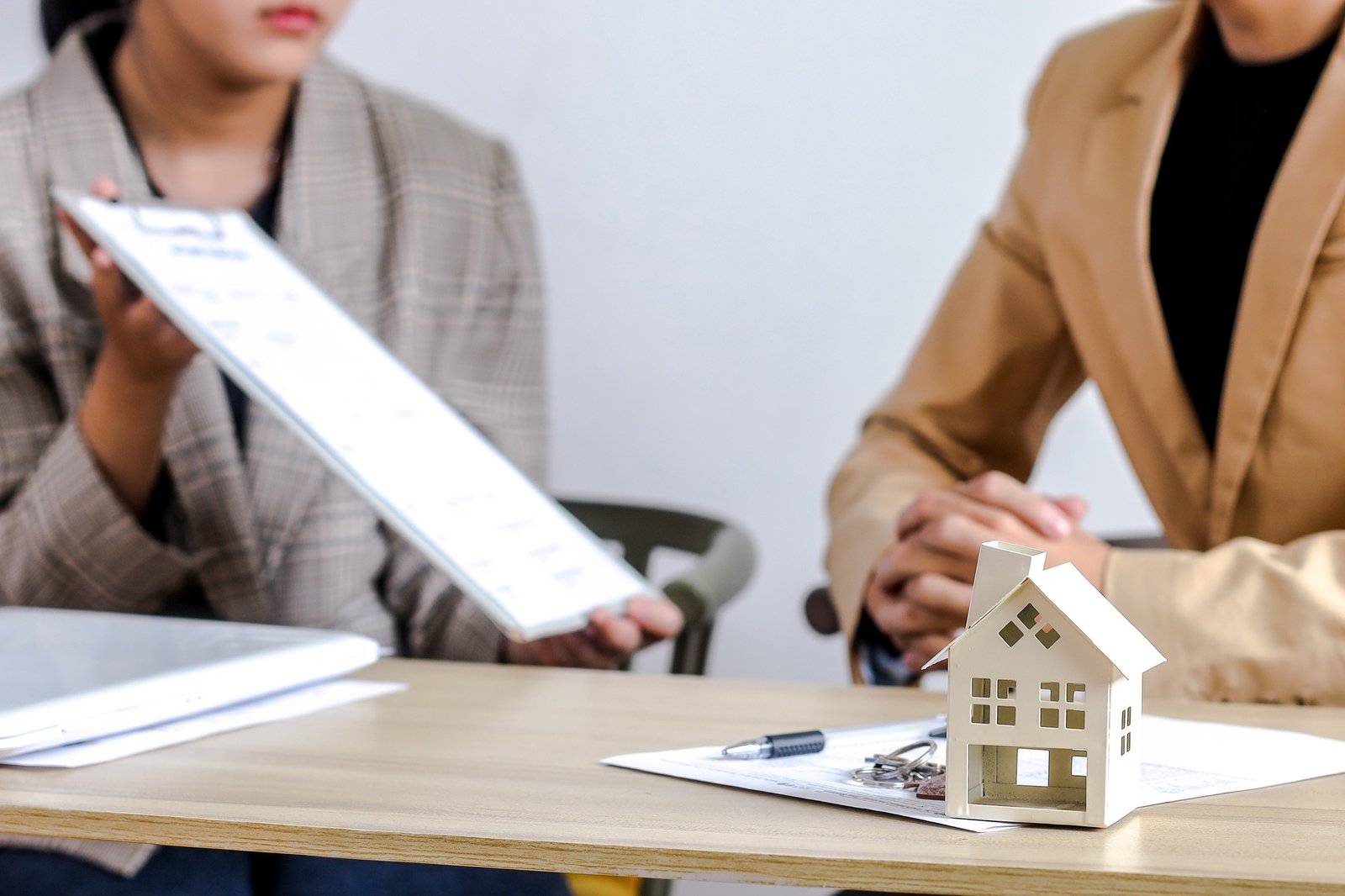 Business Interaction Focused On Property Investment Or Home Related Services With Documents