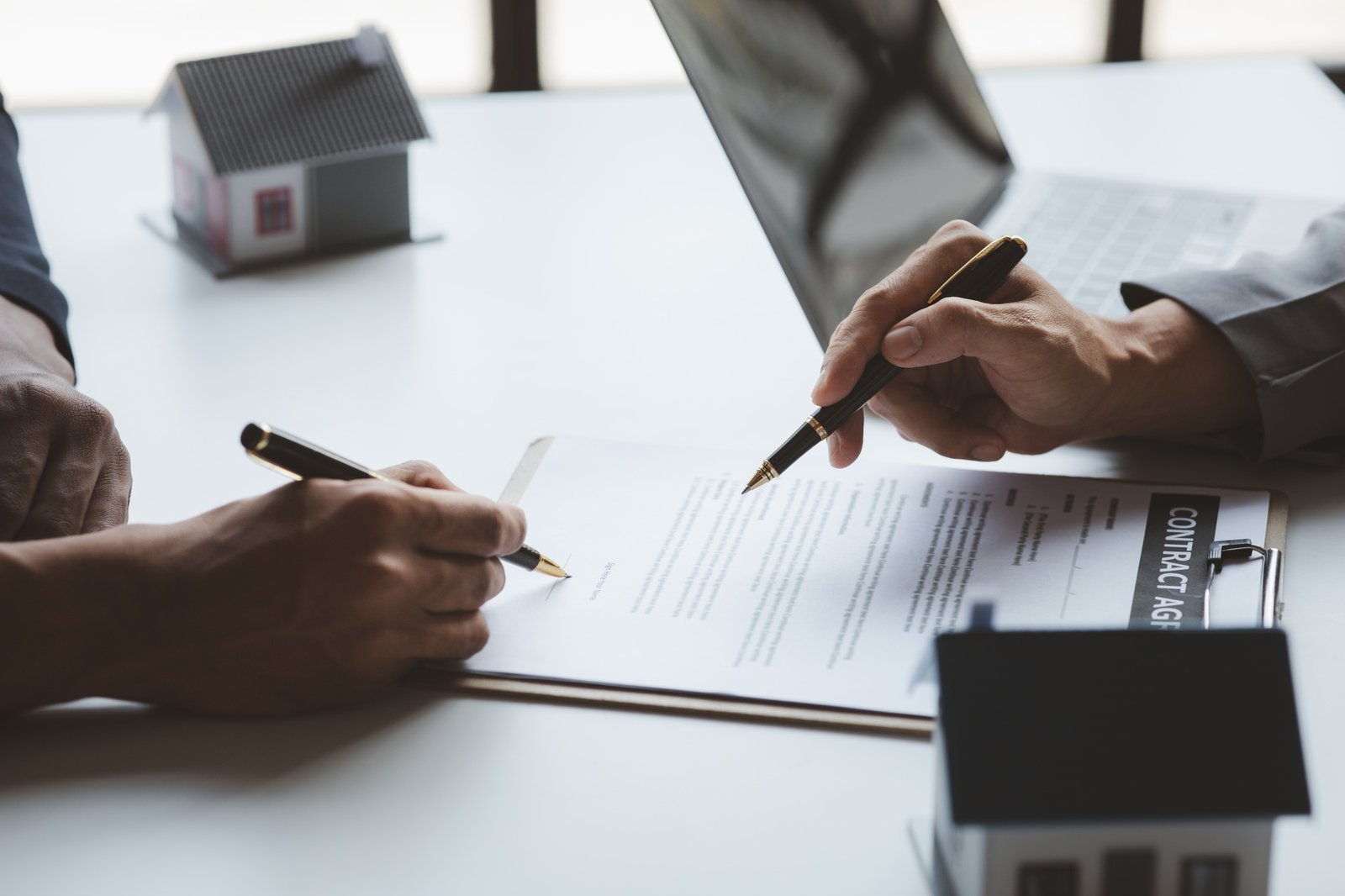 Rental company employee is calculating the cost for the customer to agree to sign a rental contract